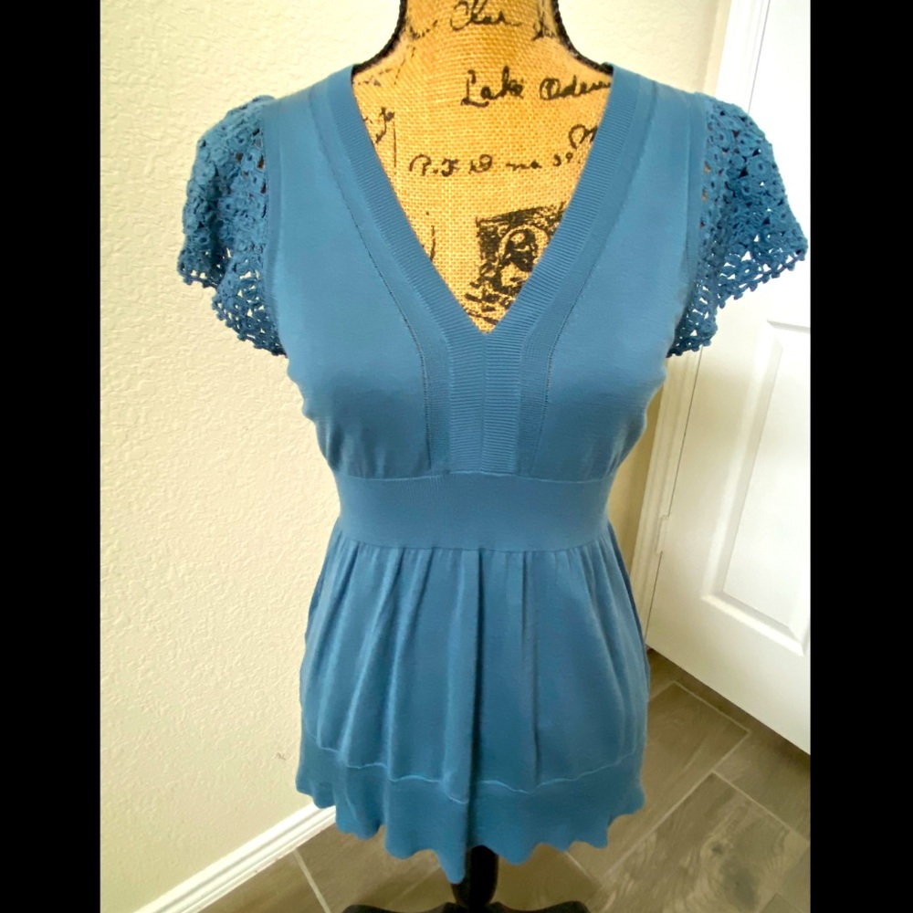 Dusty blue flowy top.